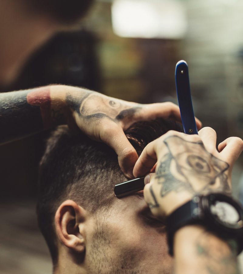 Barber shaving client
